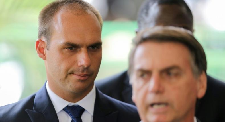 Eduardo Bolsonaro (L) is currently a member of the Brazilian parliament and accompanied his father to a private meeting with Trump during a diplomatic visit to Washington in March