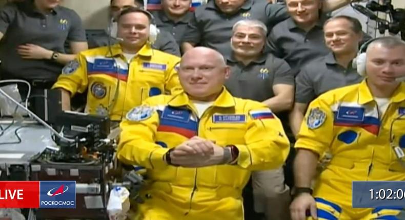 Russian cosmonauts Sergey Korsakov, Oleg Artemyev, and Denis Matveyev seen during a welcome ceremony after arriving at the International Space Station.