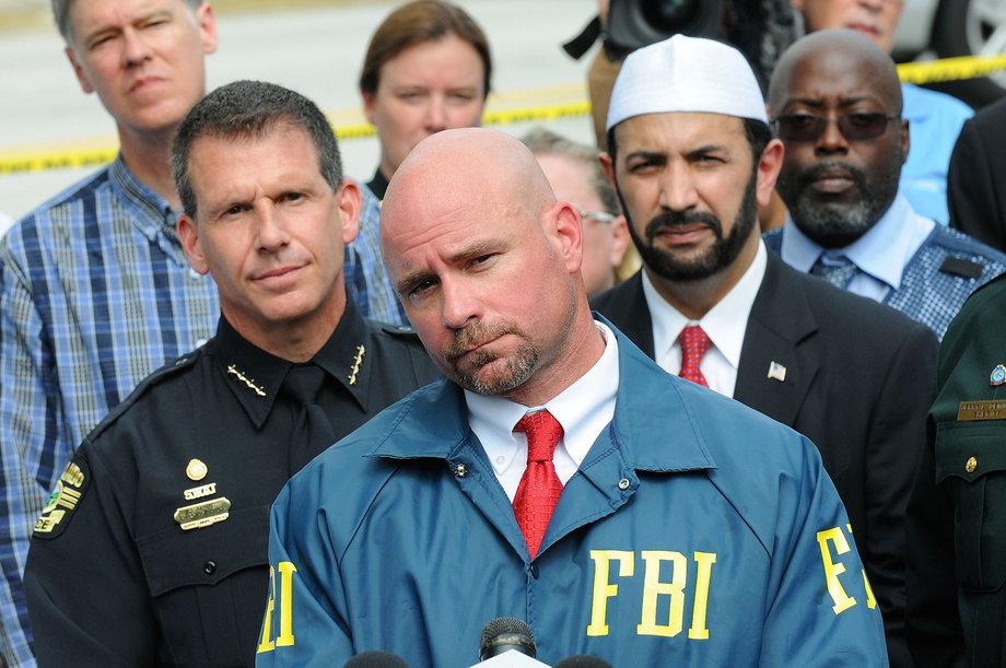 FBI assistant special agent in charge Ron Hopper (C), law enforcement and local community leaders speak during a press conference June 12, 2016 in Orlando, Florida. 50 people are reported dead and 53 were injured at a mass shooting at the Pulse nightclub in what is now the worst mass shooting in U.S. history.
