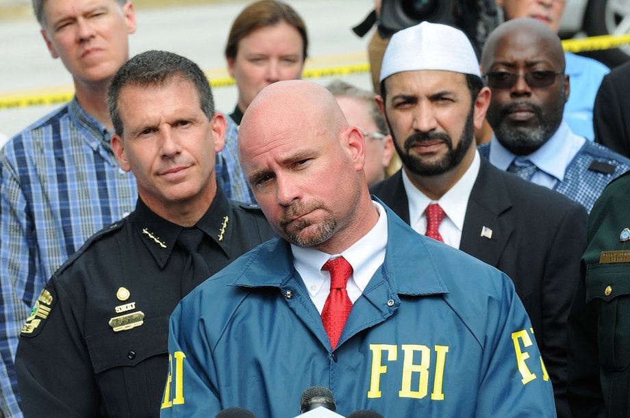 FBI assistant special agent in charge Ron Hopper (C), law enforcement and local community leaders speak during a press conference June 12, 2016 in Orlando, Florida. 50 people are reported dead and 53 were injured at a mass shooting at the Pulse nightclub in what is now the worst mass shooting in U.S. history.