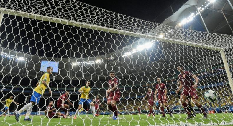 Brazil's Philippe Coutinho celebrates before his goal against Venezuela is disallowed after a VAR ruling