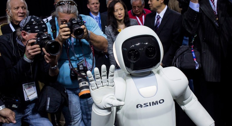 Honda Motors demonstrates its Asimo robot during a media preview of the 2014 New York International Auto Show.