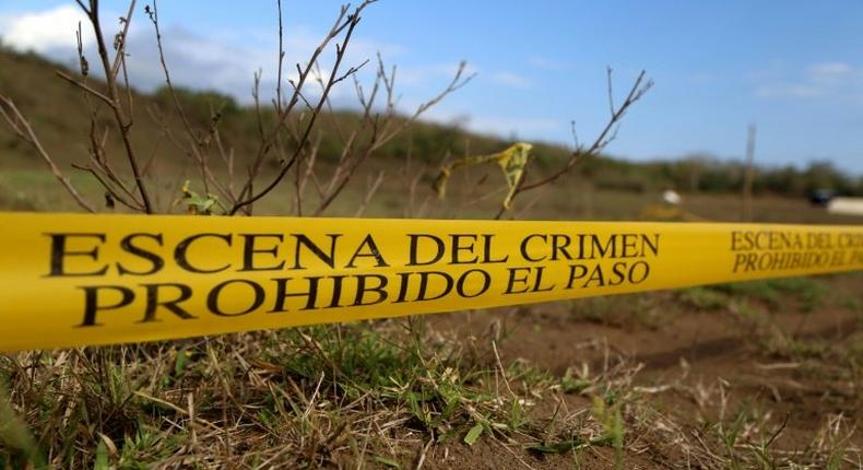 Mass graves are cordoned off by police on the outskirts of Veracruz city, Veracruz state, on March 16, 2017