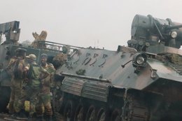 Tanks in the streets and long lines to withdraw money — here's what Zimbabwe looks like under military control