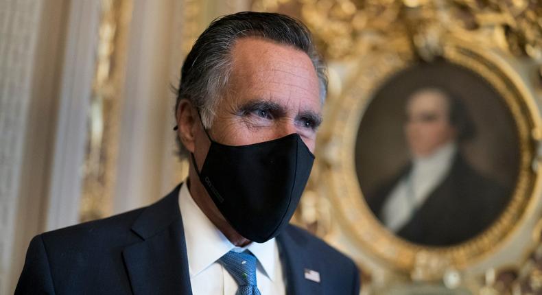 Sen. Mitt Romney, R-Utah, pauses to answer questions from reporters as senators arrive to vote on President Joe Biden's nominee for United Nation's ambassador, Linda Thomas-Greenfield, at the Capitol in Washington, Tuesday, Feb. 23, 2021.
