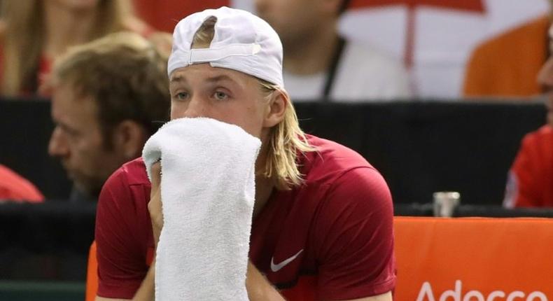 Denis Shapovalov of Canada reacts after accidentaly hitting the head referee Arnaud Gabas on February 5, 2017