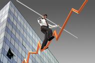 Businessman on a finance graphic aiming for the top..