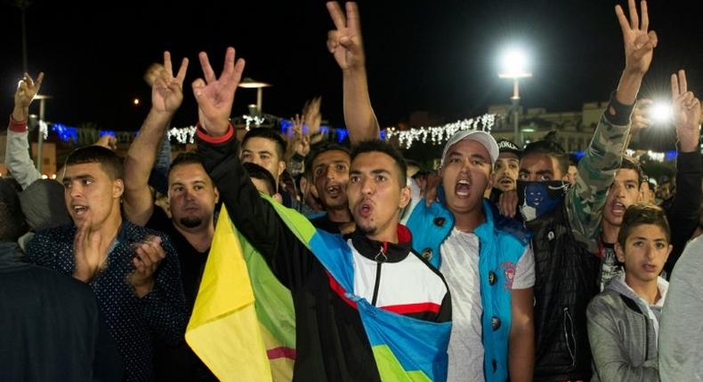 A protester wears the Berber flag in Al Hoceima, northern Morocco on October 30, 2016, following the death of fishmonger Mouhcine Fikri