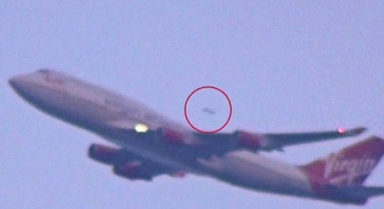 A UFO spotted overtaking a Virgin Atlantic plane taking off from JFK Airport