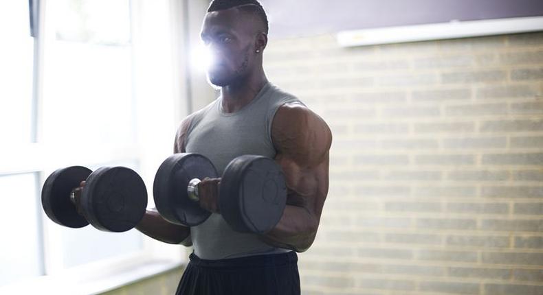 ___9181775___2018___12___9___9___man-lifting-dumbbells-in-gym-royalty-free-image-1032071022-1543875123