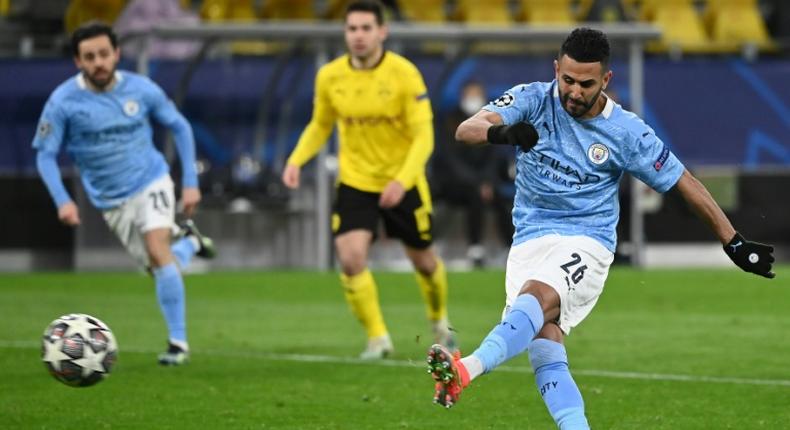 Manchester City midfielder Riyad Mahrez converts the second-half penalty against Dortmund