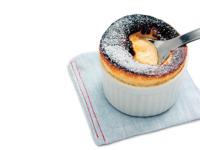 9148_stock-photo-hot-vanilla-souffle-in-ramekin-on-white-background-shutterstock_56190595
