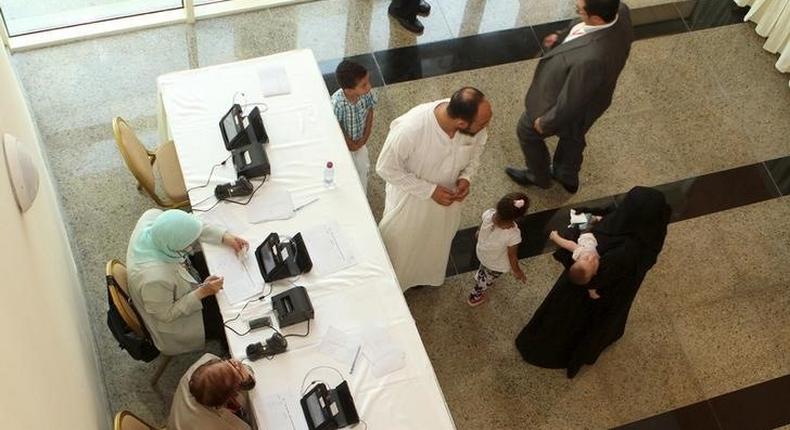 Egyptians living abroad register their information to cast their vote during the first stage of Egypt's parliamentary election, at the Egyptian embassy in Doha, Qatar October 17, 2015. The elections, continuing through to December, will produce Egypt's first elected parliament since June 2012. The election had been due to begin in March but was delayed after a court ruled part of the election law unconstitutional. REUTERS/Naseem Zeitoon