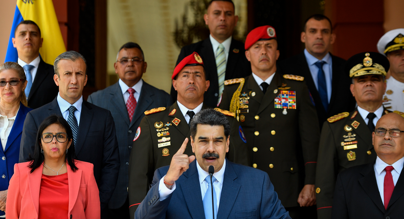 Venezuela's President Nicolas Maduro speaks at a press conference at the Miraflores Presidential Palace in Caracas, Venezuela, Thursday, March 12, 2020. Maduro has suspended flights to Europe and Colombia for a month, citing concerns for the new coronavirus. Maduro added in a national broadcast that the illness has not yet been detected in Venezuela, despite it being confirmed in each bordering country, including Colombia, Brazil and Guyana.  (AP Photo/Matias Delacroix)