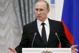 Russia's President Vladimir Putin speaks during a news conference after a meeting with his French co