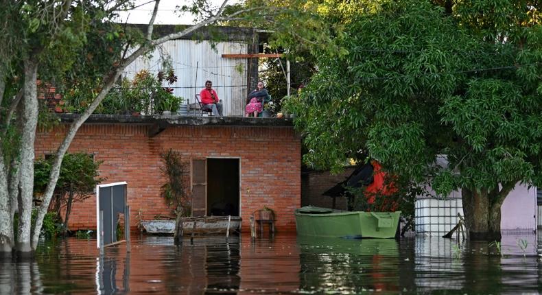 Some residents living close to the Paraguay River have had to move into the upper floors of their homes to escape the rising floodwaters
