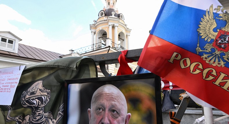 This photograph taken on August 27, 2023, shows a portrait of late head of Wagner paramilitary group, Yevgeny Prigozhin displayed at a makeshist memorial in Moscow.NATALIA KOLESNIKOVA/AFP via Getty Images