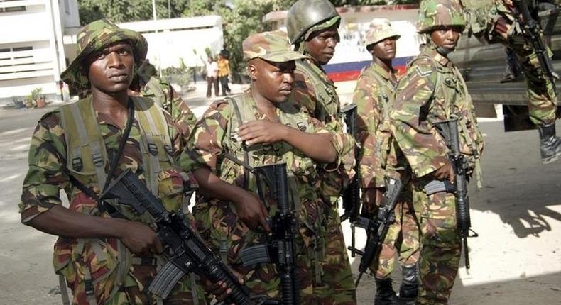 Members of the Kenyan Defence Forces (KDF) arrive at the police station, where its senior police commandant was killed, in Changamwe area of the Kenyan Coast, March 4, 2013. REUTERS/Charles Makunda