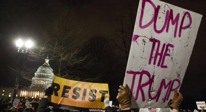 Demonstrators protest against US President Donald Trump and his administration's travel ban outside the US Supreme Court in Washington, DC, on January 30, 2017