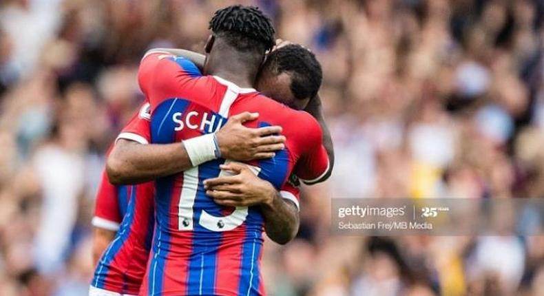 Jeffrey Schlupp embraces Jordan Ayew after the goal