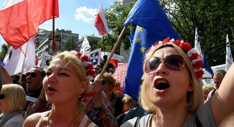 Demonstrators protest against judicial reforms in Warsaw on July 16, 2017