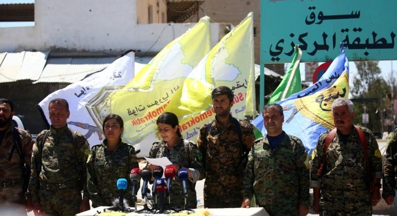 Commanders of the US-backed Syrian Democratic Forces (SDF), made up of an alliance of Arab and Kurdish fighters, in the recaptured Syrian town of Tabqa as they advance in their battle for the Islamic State's (IS) bastion of Raqa