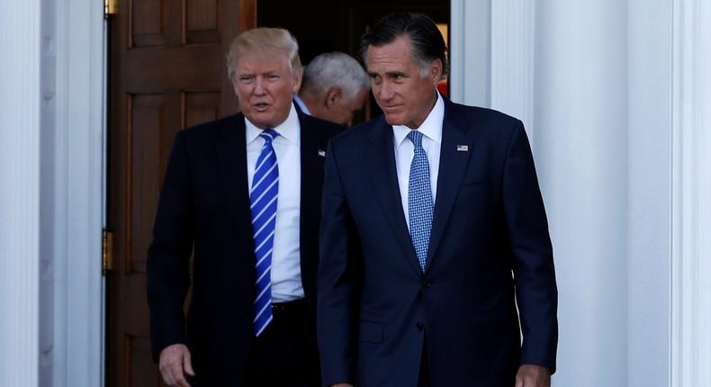 FILE PHOTO: U.S. President-elect Donald Trump (L) and former Massachusetts Governor Mitt Romney emerge after their meeting at the main clubhouse at Trump National Golf Club in Bedminster, New Jersey, U.S., November 19, 2016.  REUTERS/Mike Segar/File Photo