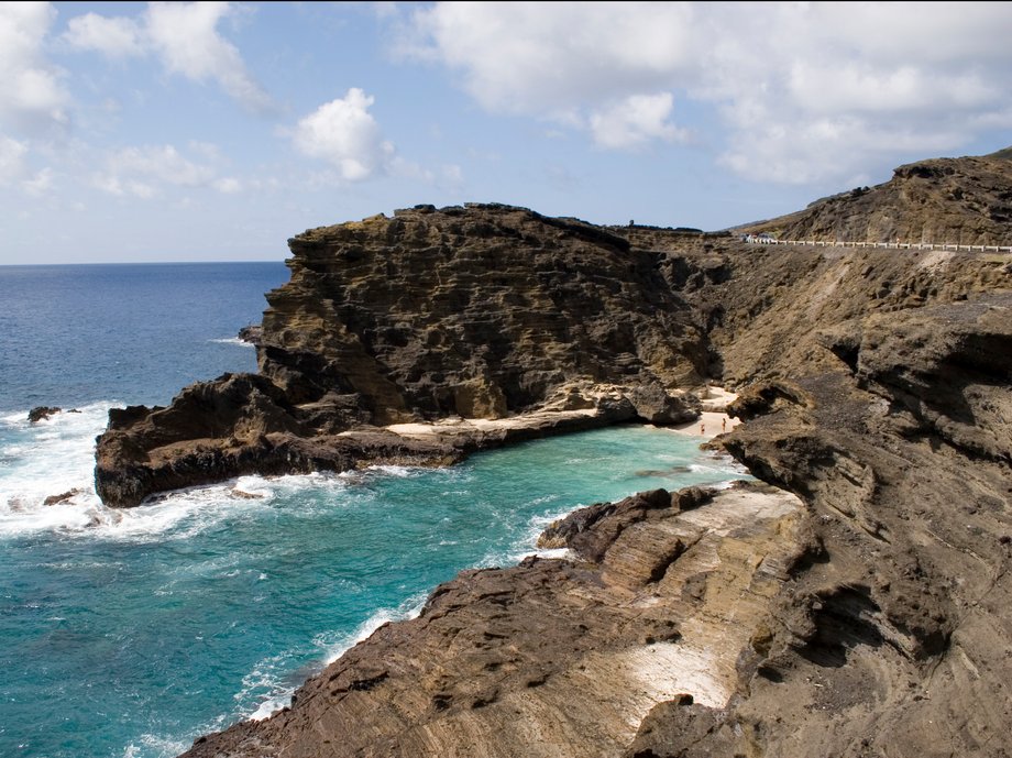 Halona Beach Cove sits tucked between Halona Point and the Halona Blowhole in Oahu, Hawaii. Made popular in the movie “From Here to Eternity”, the beach here was nicknamed Eternity Beach and is accessed by hiking down the surrounding rocks. Explore the little private haven hidden from the main road, but avoid swimming here during strong currents as it can be dangerous.