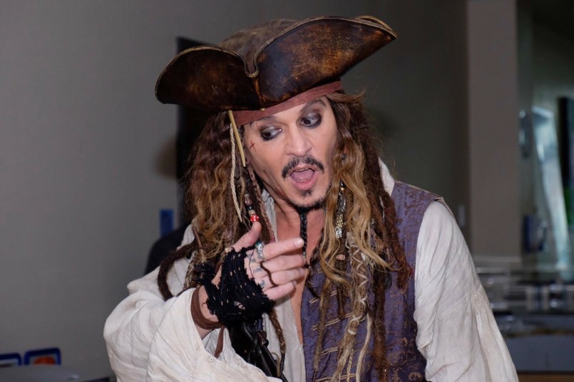 Johnny Depp (dressed up as Captain Jack Sparrow) swooshed in to surprise some sick children at a Canadian hospital on Monday [August 14, 2017]. The Pirates of the Caribbean actor, 54, declared "I come in peace" as he paraded around the wards of the Vancouver hospital. "Captain Jack's ship arrived under a veil of secrecy and was met at the entrance by patients who gave the pirate the lay of the land," announced a spokesperson from the British Columbia Children's Hospital. "Blowing into the playroom with his first mates Hollywood actor Johnny Depp brought his pirate playfulness to the children assembled for a Pirate Party". The kids seemed delighted by the swashbuckling star, who stayed with them for almost six hours. Pictured: Johnny Depp (dressed up as Captain Jack Sparrow) with sick children in Vancouver, British Columbia, Canada Splash News and Picture Agency does not claim any Copyright or License in the attached material. Any downloading fees charged by Splash are for Splash's services only, and do not, nor are they intended to, convey to the user any Copyright or License in the material. By publishing this material , the user expressly agrees to indemnify and to hold Splash harmless from any claims, demands, or causes of action arising out of or connected in any way with user's publication of the material.