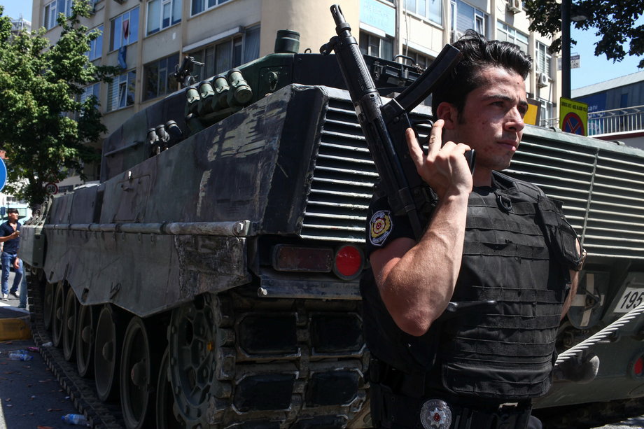 Turkish police stand guard near an abandoned tank in Uskudar District on July 16 in Istanbul.