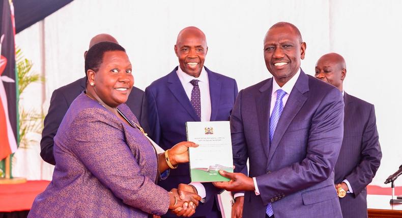 President William Ruto receiving a report from the Presidential Working Party on Education Reforms at State House on August 1, 2023