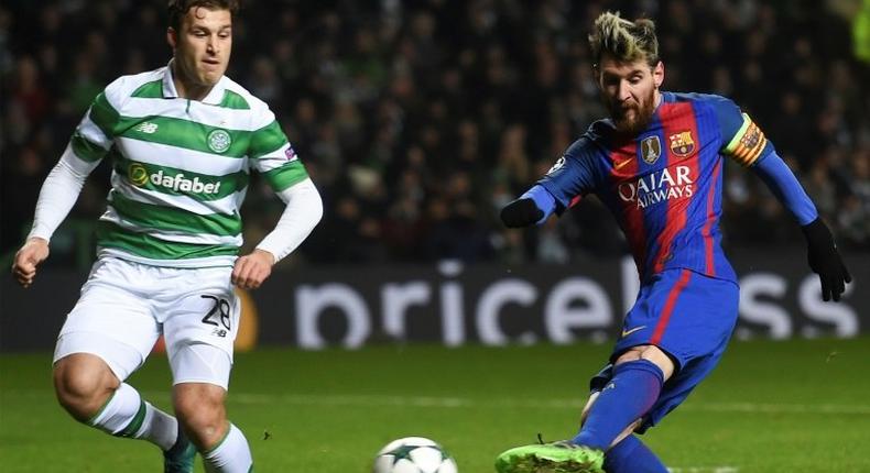 Barcelona's striker Lionel Messi (R) shoots to score against Celtic on November 23, 2016