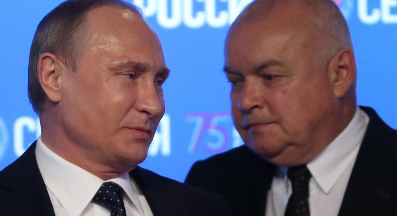 Russian President Vladimir Putin and TV host Dmitry Kiselyov in Moscow, Russia, in June 2016.