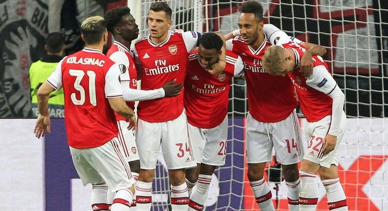 Arsenal's players celebrate after English midfielder Joe Willock (centre) scored the opening goal at Eintracht Frankfurt on Thursday in the Europa League