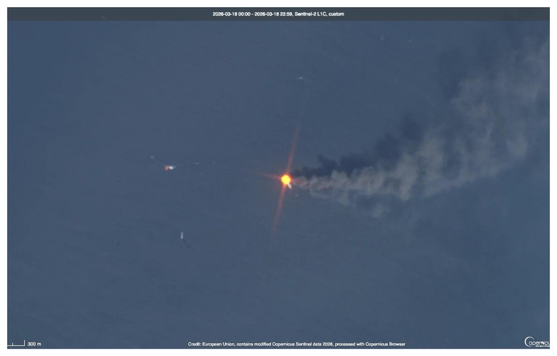 Satellite imagery dated October 14, 2026, shows shipping containers and debris floating near a sunken vessel off Oman, close to the Strait of Hormuz. Photo: European Union/Copernicus Sentinel-2/Handout via Reuters.
