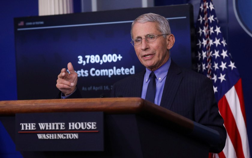 President Trump looks at Dr. Anthony Fauci as Fauci addresses the daily coronavirus response briefin