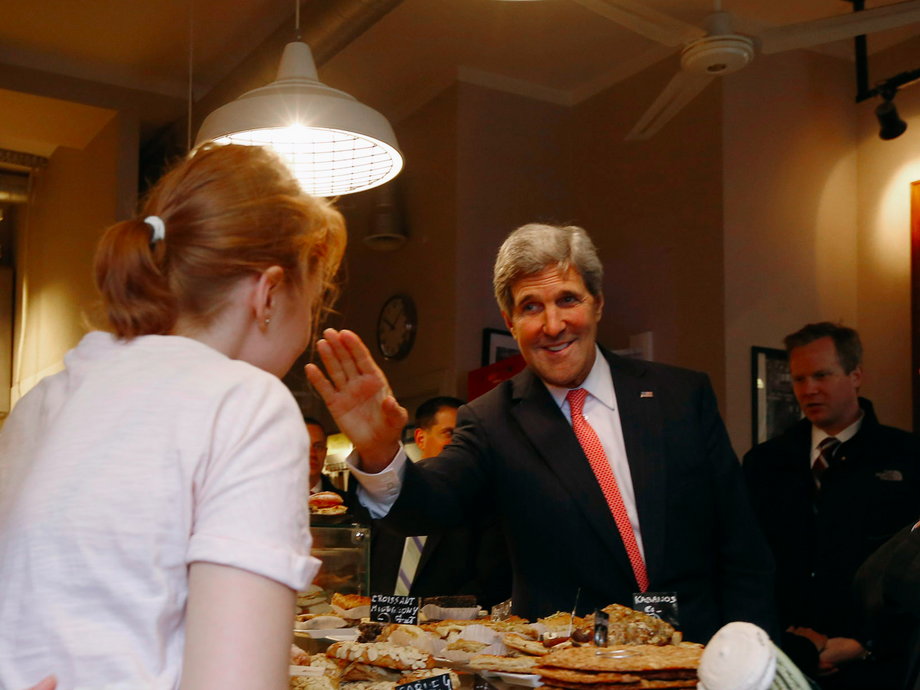 POLAND: Kerry buys pastries at Cafe Baguette during a walking tour of central Warsaw, November 5, 2013.
