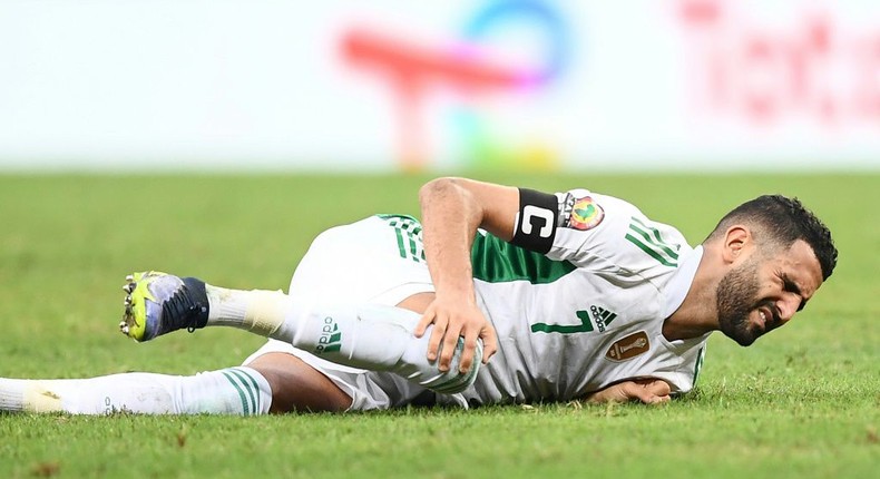 Algeria captain Riyad Mahrez is fouled during a loss to the Ivory Coast in Douala that ended their Africa Cup of Nations campaign Creator: CHARLY TRIBALLEAU