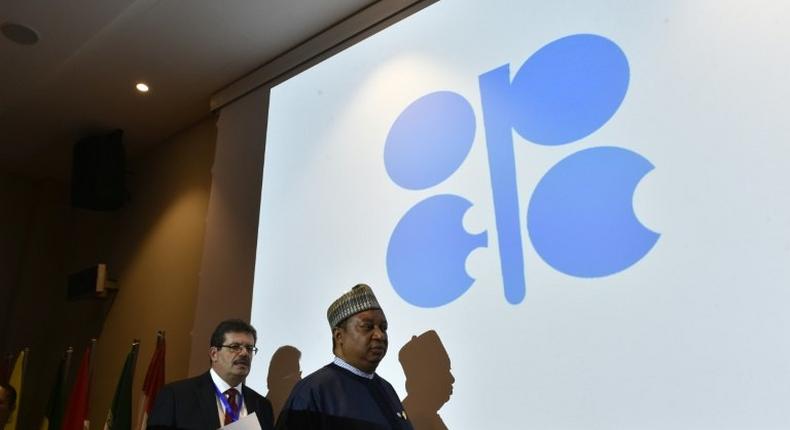 Secretary General of the Organization of Petroleum Exporting Countries (OPEC), Nigeria's Mohammed Barkindo (R), arrives for a press conference following an informal meeting between OPEC members in the Algerian capital Algiers on September 28, 2016