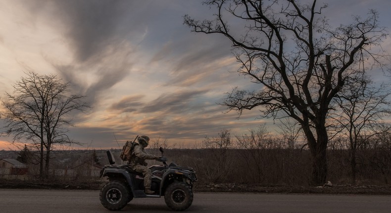 A Ukrainian serviceman drives a quad bike on a road that leads to the town of Chasiv Yar, in the Donetsk region, on March 30, 2024.Photo by ROMAN PILIPEY/AFP via Getty Images