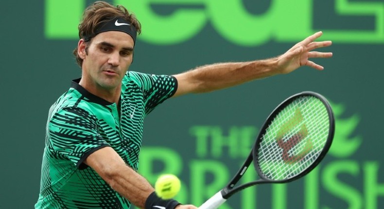 Roger Federer of Switzerland returns a shot against Frances Tiafoe during day 6 of the Miami Open at Crandon Park Tennis Center on March 25, 2017 in Key Biscayne, Florida