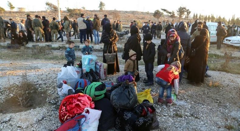 Syrians evacuated from rebel-held neighbourhoods in the embattled city of Aleppo, arrive in opposition-controlled Khan al-Aassal region, west of the city