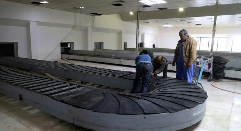 Workers at the Libyan capital's Mitiga airport