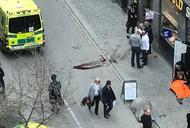 Ambulance in a street near the site were a truck was driving into a crowd in central Stockholm