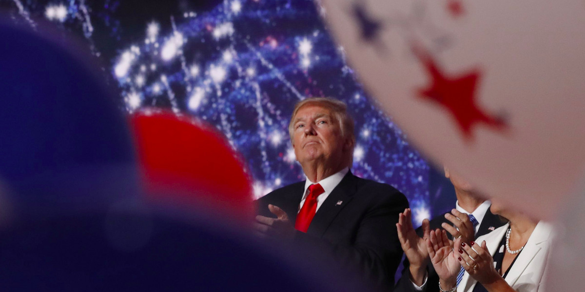 Donald Trump watches balloons, confetti, and electronic fireworks at the conclusion of the final session of the Republican National Convention in Cleveland, Ohio, July 21, 2016.