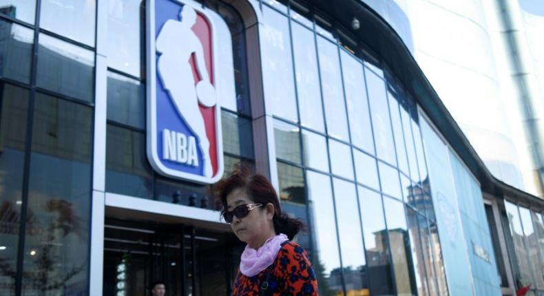 A bipartisan group of eight US lawmakers on Wednesday urged NBA commissioner Adam Silver to suspend all league activities in China until a sponsor and telecast boycott ends, which would close such places as the NBA merchandise store in Beijing