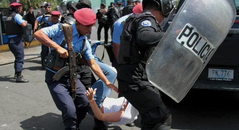 Nicaraguan riot police briefly arrested around 100 people during the weekend demonstrations, prompting the opposition alliance to withdraw from peace talks