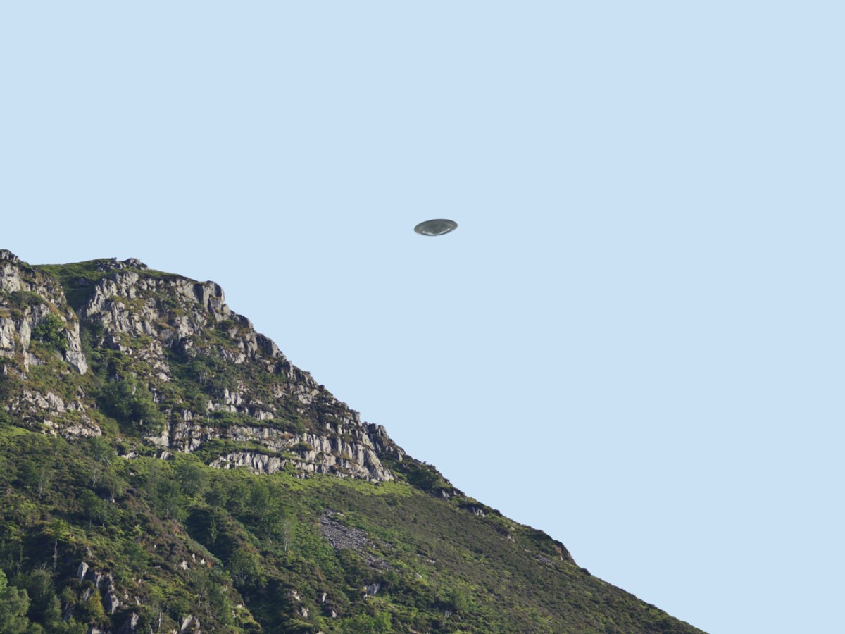 Flying,Saucer,Ufo,Over,Bluff/,Cliff,Side,In,Summer,,Clear