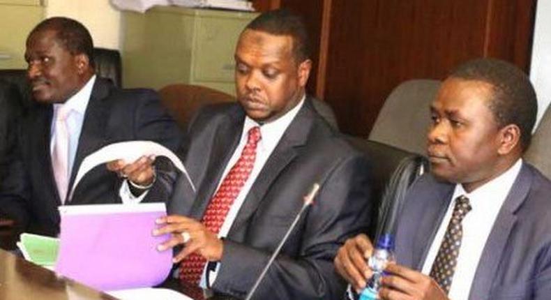 Sports CS Hassan Wario (middle) and his PS Richard Ekai ( rght) addresses the Labour Committee of the National Assemble on Rio Olympics fiasco at Parliament Buildings.