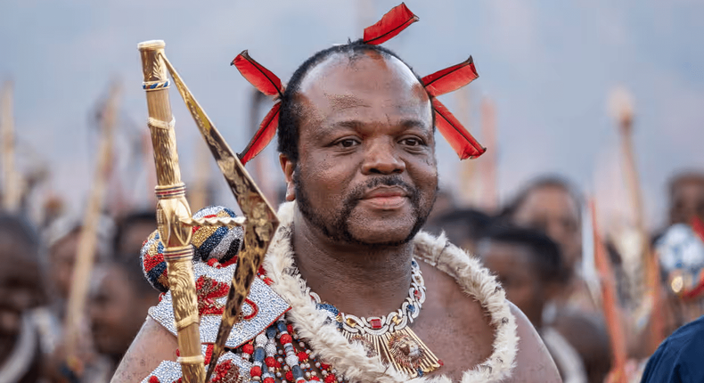 King Mswati III, who took the throne in 1986, arrives in ceremonial dress for the annual reed dance. Photograph: Emmanuel Croset/AFP/Getty Images